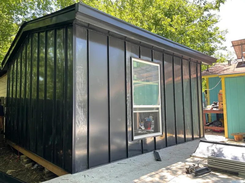 Black standing seam metal wall panels for Metal Roof Installation in Mont Belvieu