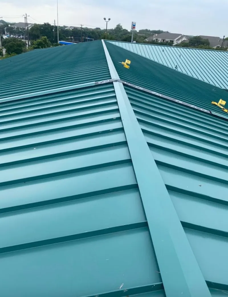 Green commercial metal roof ridge and valley for Metal Roof Repair in Mont Belvieu